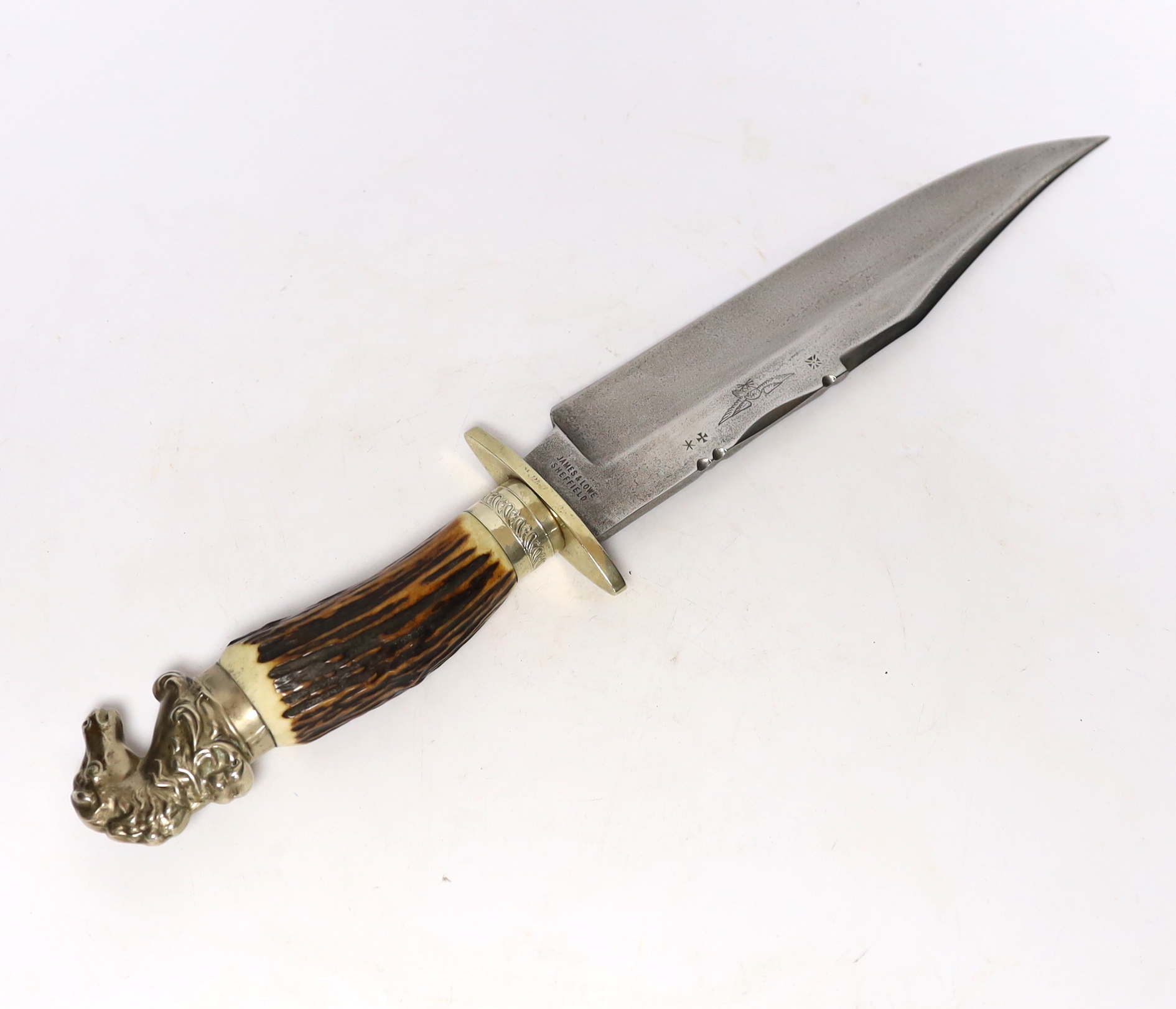 A James & Lowe Bowie knife, clip point blade with unsharpened false edge and decorative filework, stamped James & Lowe Sheffield, with Eagle, Cross and Star marks, stag horn handle with nickel silver guard, and horse-hea